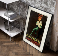Fire-breathing man clutching cotton wool poster in a black frame leaning beside a shelf in a raw-plaster loft