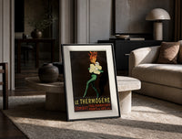 Fire-breathing man clutching cotton wool print in a black frame leaning on a travertine table in a sunlit lounge