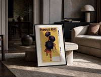People walking with black umbrellas print in a black frame leaning on a travertine table in a sunlit lounge