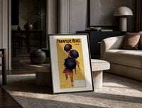 Cappiello Parapluie-Revel figures under black umbrellas print on the floor, leaning against a travertine table