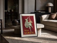 Pierrot serving plate of spaghetti print in a black frame leaning on a travertine table in a sunlit lounge