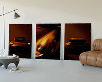 Porsche 911 Wall Art Set three-panel set displayed beside a brown leather sofa