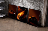 Porsche 911 Wall Art Set set of three black-framed prints leaning against a raw-plaster wall