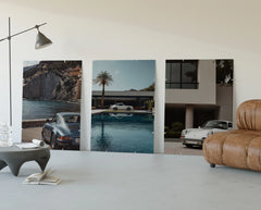 Porsche 911 Coastal Poster Set three-panel set displayed beside a brown leather sofa