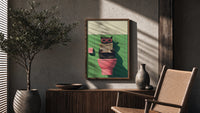Cat on the Toilet Reading the Paper poster framed above a fluted sideboard beside a potted tree