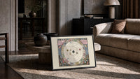 Antique celestial planisphere star chart print in a slim black frame leaning on a travertine coffee table