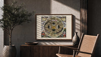 Copernican solar system celestial map print in a wood frame above a fluted sideboard beside an olive tree