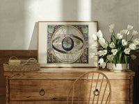 Ptolemaic celestial sphere armillary map print in an oak frame on a farmhouse dresser beside white tulips