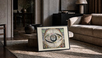 Ptolemaic celestial sphere armillary map print in a slim black frame leaning on a travertine coffee table