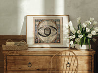 Ptolemaic celestial system with globe print in an oak frame on a farmhouse dresser beside white tulips