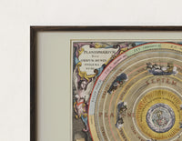 Close-up of the Ptolemaic celestial map of universe print's dark wood frame corner and archival matte paper