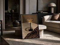 Champagne Coupe with Leopard print on the floor, leaning against a travertine table