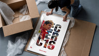 Charles Leclerc F1 driver portrait framed print being unpacked from protective bubble wrap and a box