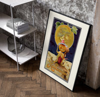 Pumpkin-headed figure with harvest moon poster in a black frame leaning beside a shelf in a raw-plaster loft