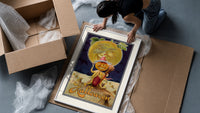 Pumpkin-headed figure with harvest moon framed print being unpacked from protective bubble wrap and a box