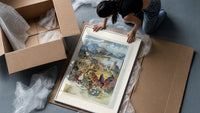 French spa town travel scenery framed print being unpacked from protective bubble wrap and a box
