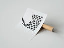 Rolled Hand waving checkered racing flag poster beside its crush-resistant kraft shipping tube