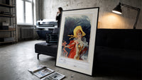 Elegant woman in yellow hat print in a slim black frame leaning on a dark sofa in a concrete print studio