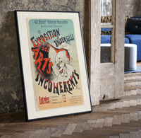 Laughing clown face print in a black frame leaning beside a vintage door on parquet