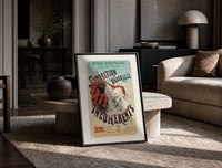 Laughing clown face print in a black frame leaning on a travertine table in a sunlit lounge