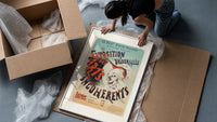 Laughing clown face framed print being unpacked from protective bubble wrap and a box
