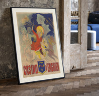 Children riding horses with fireworks print in a black frame leaning beside a vintage door on parquet
