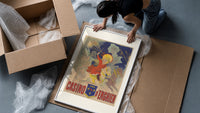 Children riding horses with fireworks framed print being unpacked from protective bubble wrap and a box