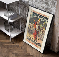 Female conductor leading violin orchestra poster in a black frame leaning beside a shelf in a raw-plaster loft