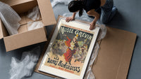 Female conductor leading violin orchestra framed print being unpacked from protective bubble wrap and a box