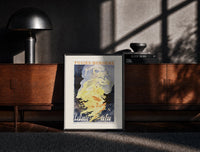 Black-framed Woman dancing in flames print on a moody console with designer coffee-table books