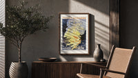 Woman dancing in flames poster framed above a fluted sideboard beside an olive tree