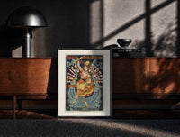 Black-framed Dancing woman on trapeze print on a moody console with designer coffee-table books