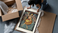 Dancing woman on trapeze framed print being unpacked from protective bubble wrap and a box