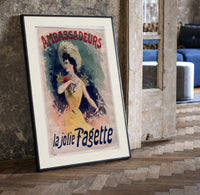 Elegant woman in yellow dress print in a black frame leaning beside a vintage door on parquet