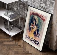 Elegant woman in yellow dress poster in a black frame leaning beside a shelf in a raw-plaster loft