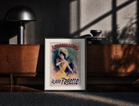 Black-framed Elegant woman in yellow dress print on a moody console with designer coffee-table books