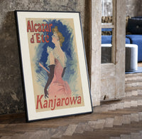 Elegant woman in pink dress print in a black frame leaning beside a vintage door on parquet