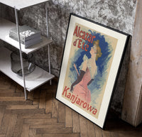 Elegant woman in pink dress poster in a black frame leaning beside a shelf in a raw-plaster loft