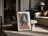 Elegant woman in pink dress print in a black frame leaning on a travertine table in a sunlit lounge