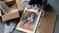 Elegant woman in pink dress framed print being unpacked from protective bubble wrap and a box