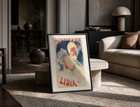 Woman in yellow hat with roses print in a black frame leaning on a travertine table in a sunlit lounge