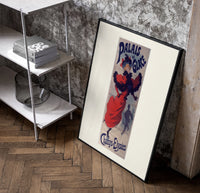 Woman ice skating in red dress poster in a black frame leaning beside a shelf in a raw-plaster loft