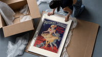 Dancing woman in yellow dress framed print being unpacked from protective bubble wrap and a box