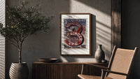 Woman using Singer sewing machine poster framed above a fluted sideboard beside an olive tree