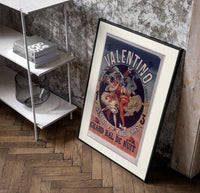 Costumed dancers at masquerade ball poster in a black frame leaning beside a shelf in a raw-plaster loft