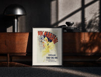 Black-framed Woman dancing pouring wine print on a moody console with designer coffee-table books