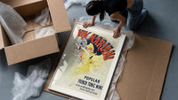 Woman dancing pouring wine framed print being unpacked from protective bubble wrap and a box