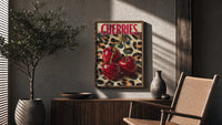 Cherries on Leopard poster framed above a fluted sideboard beside a potted tree