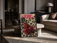 Cherries on Leopard print on the floor, leaning against a travertine table