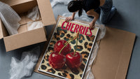 Cherries on Leopard framed print being unpacked from protective bubble wrap and a box